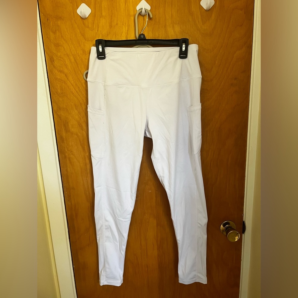 White athletic leggings with pockets. Size large